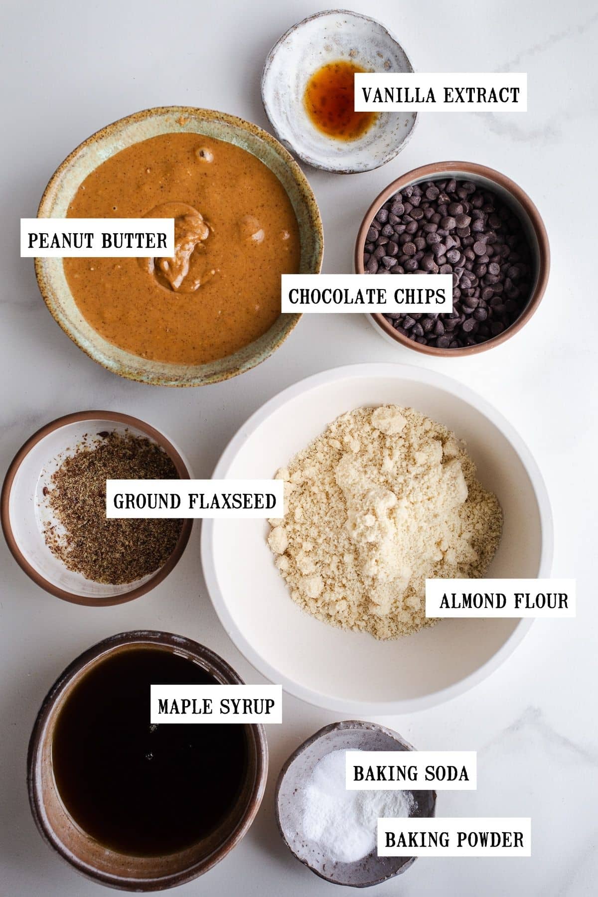 Ingredients to make maple cookies in small bowls.