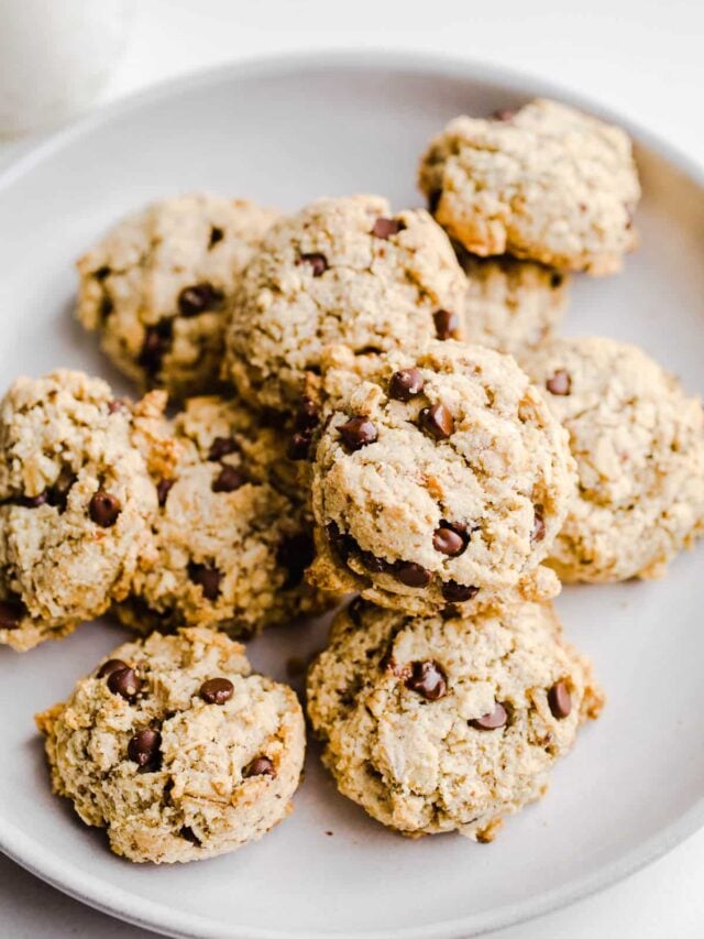 Cookies stacked on a white plate.