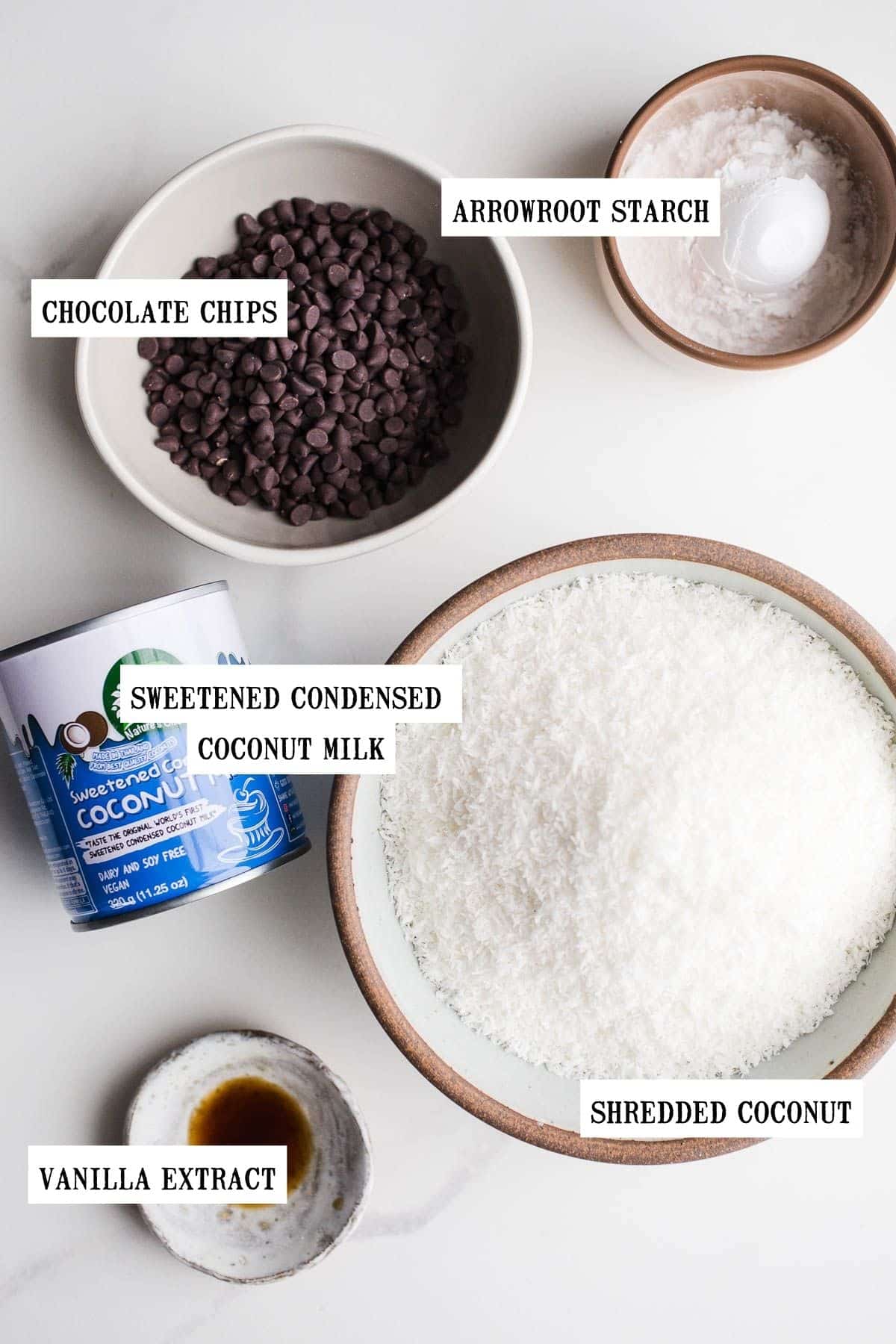 Ingredients to make macaroons in bowls of different sizes.