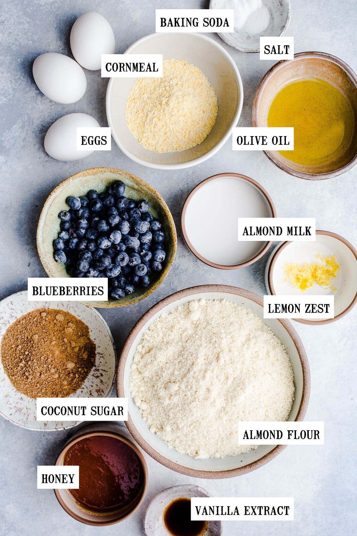 Ingredients for blueberry cake in small bowls.