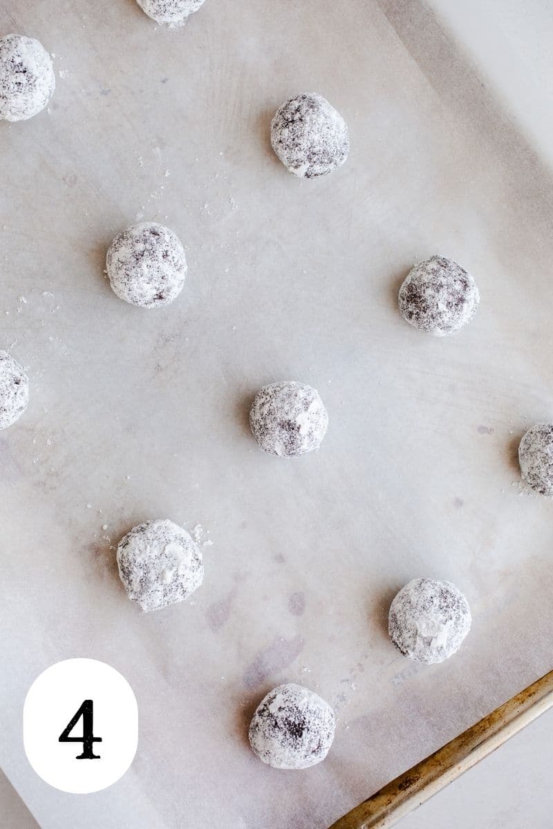 Cookie dough balls on a baking sheet. 