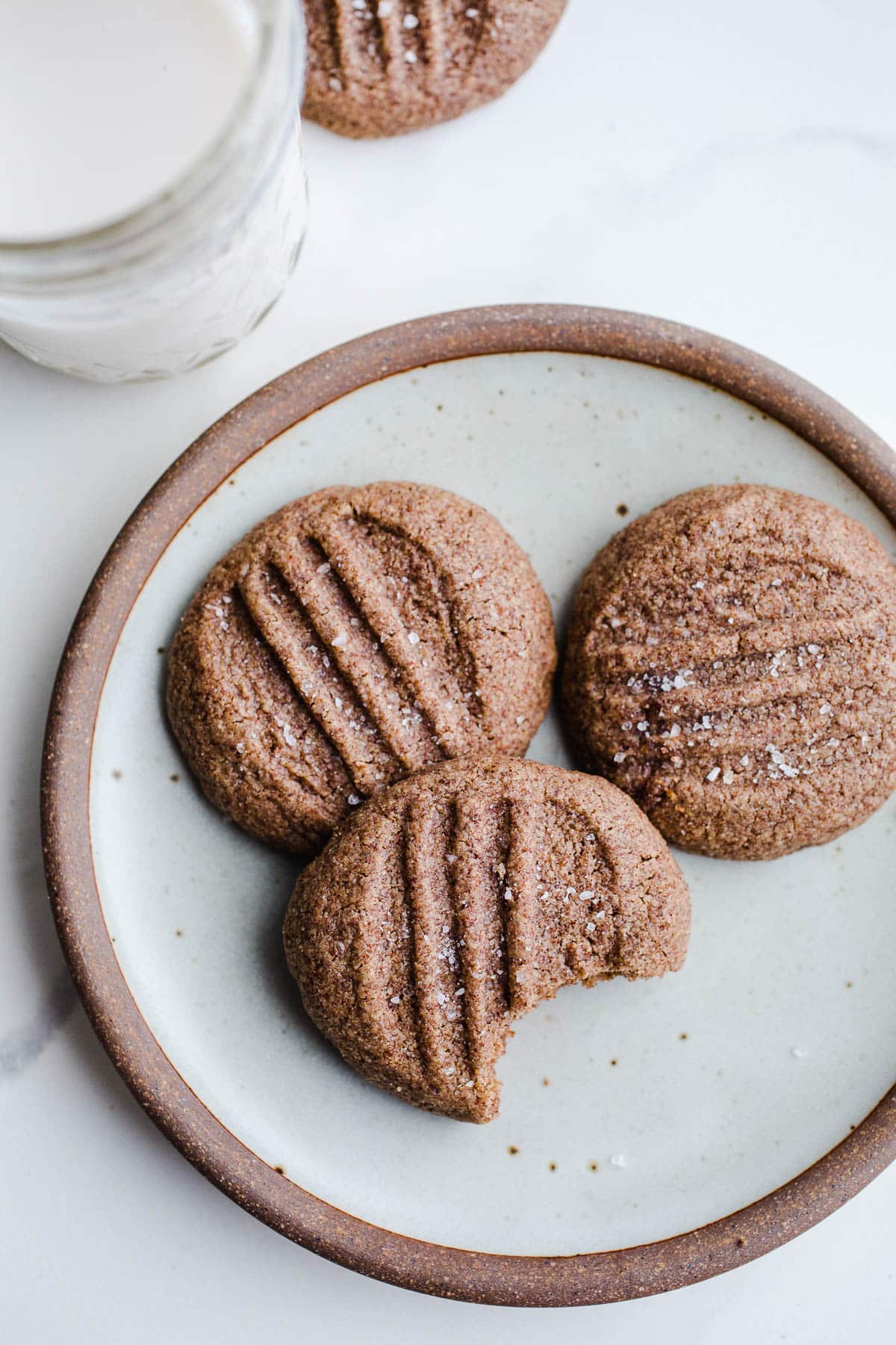 Teff almond butter cookies on a rustic plate.