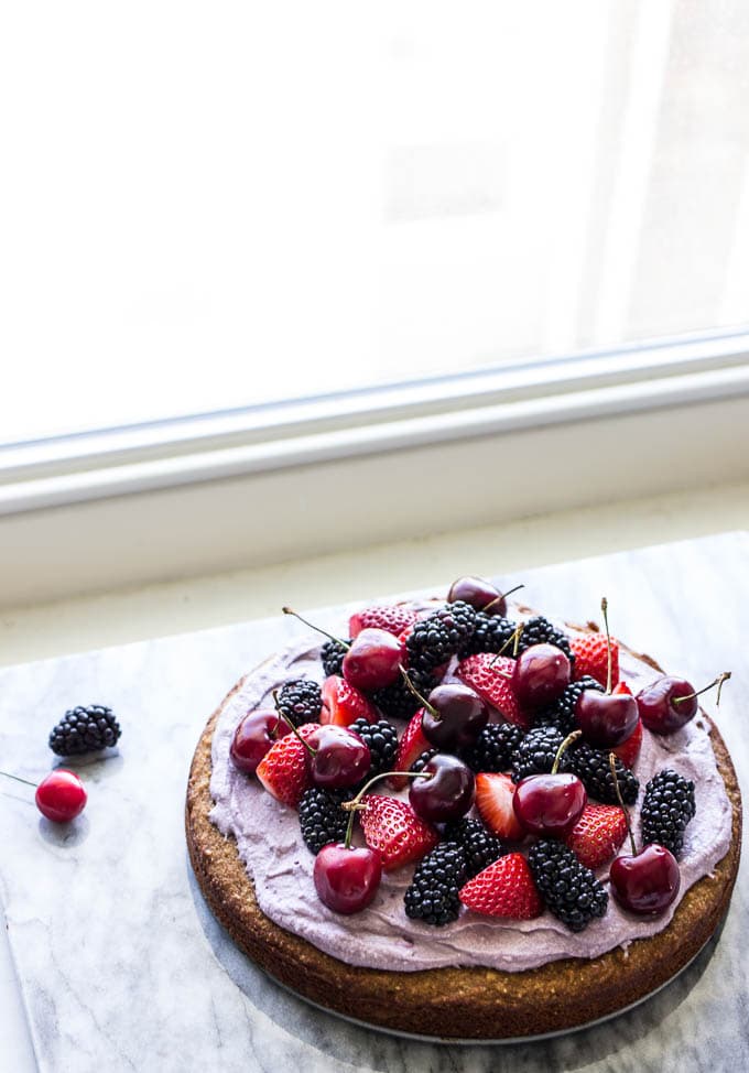 Coconut Cake with Blackberry-Coconut Whipped Cream and Mixed Berries #glutenfree | saltedplains.com