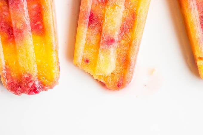 Mango Raspberry Bellini Popsicles | saltedplains.com