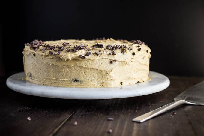 frosted cake on cake stand