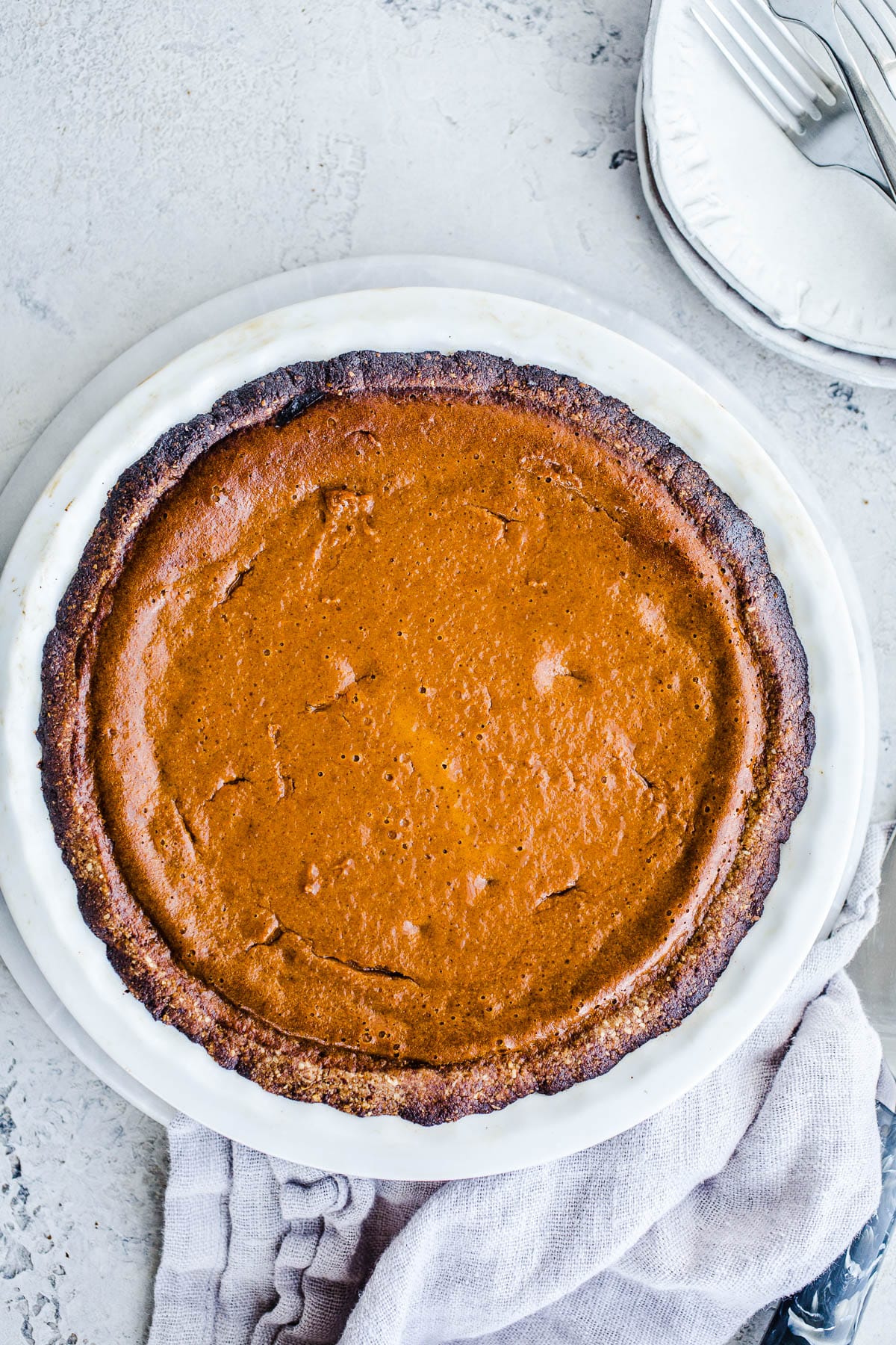 A carrot pie in a white pie plate. 