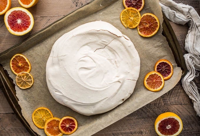 A baked pavlova on a baking sheet. 