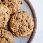 Oatmeal chocolate chip cookies on a plate.