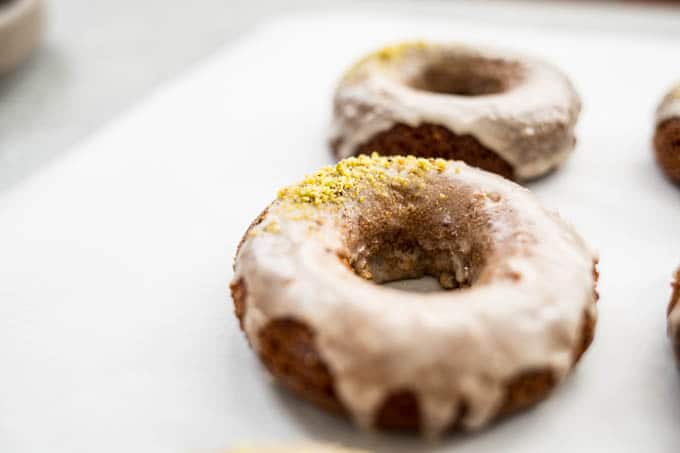 Irish Coffee Cake Donuts with glaze and pistachios.