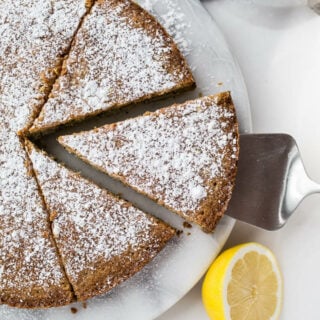 Poppyseed cake on a marble platter.