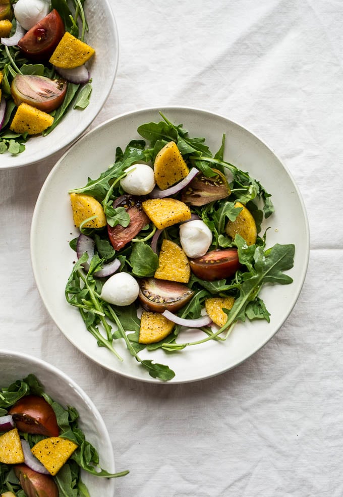 Three bowls filled with salad.