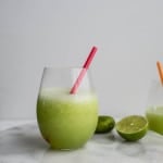 A honeydew daiquiri on a marble platter.