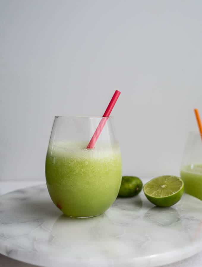 A honeydew daiquiri on a marble platter.