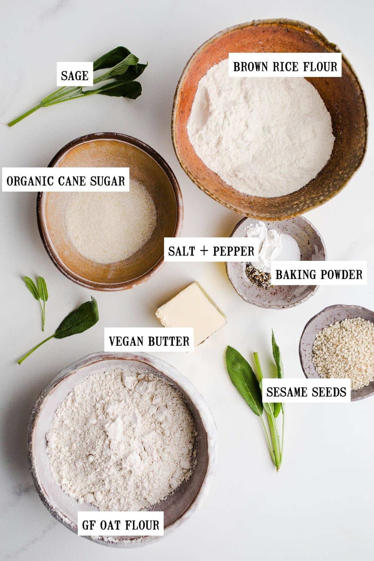 Ingredients for oat crackers in bowls of different sizes.
