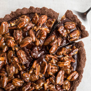 A chocolate tart with pecans.