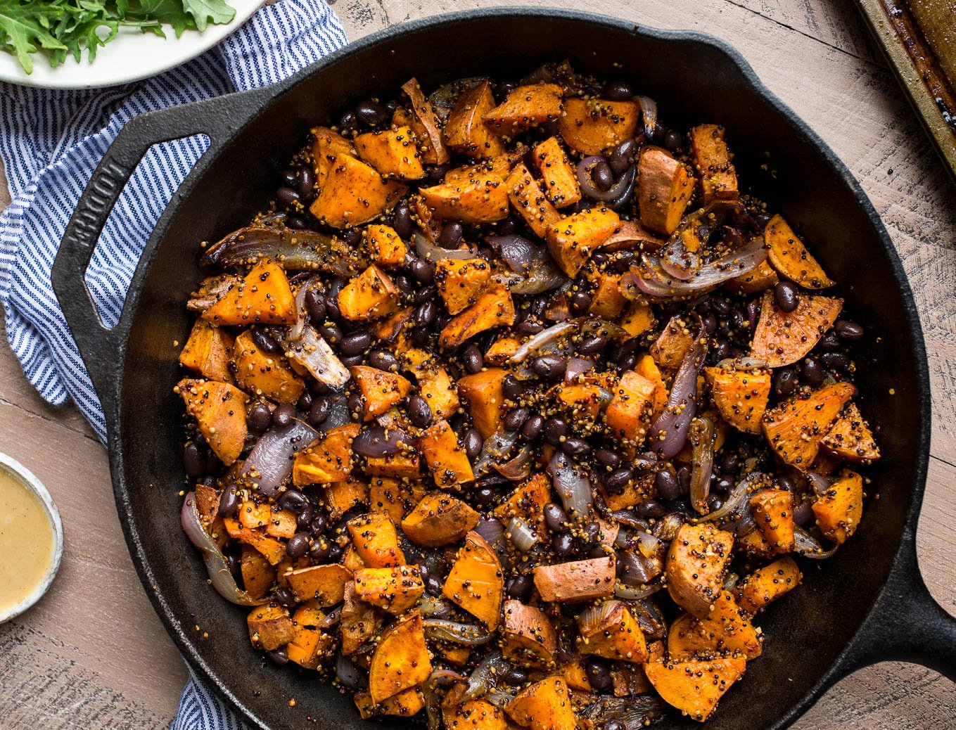 Roasted Sweet Potato, Black Beans, and Fried Quinoa in cast iron pan