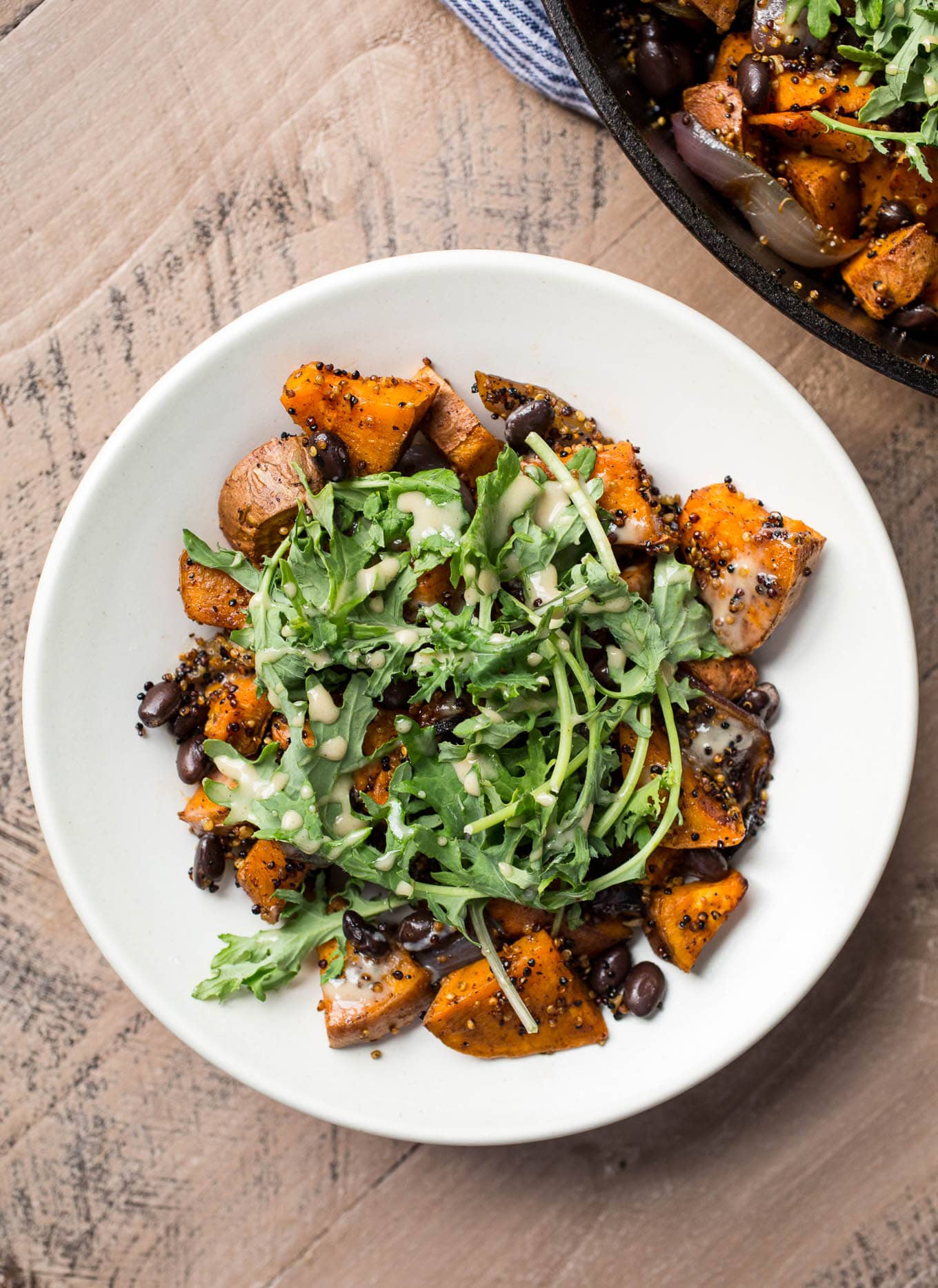 Roasted Sweet Potato, Black Bean, and Fried Quinoa Skillet with Maple-Tahini Sauce | saltedplains.com