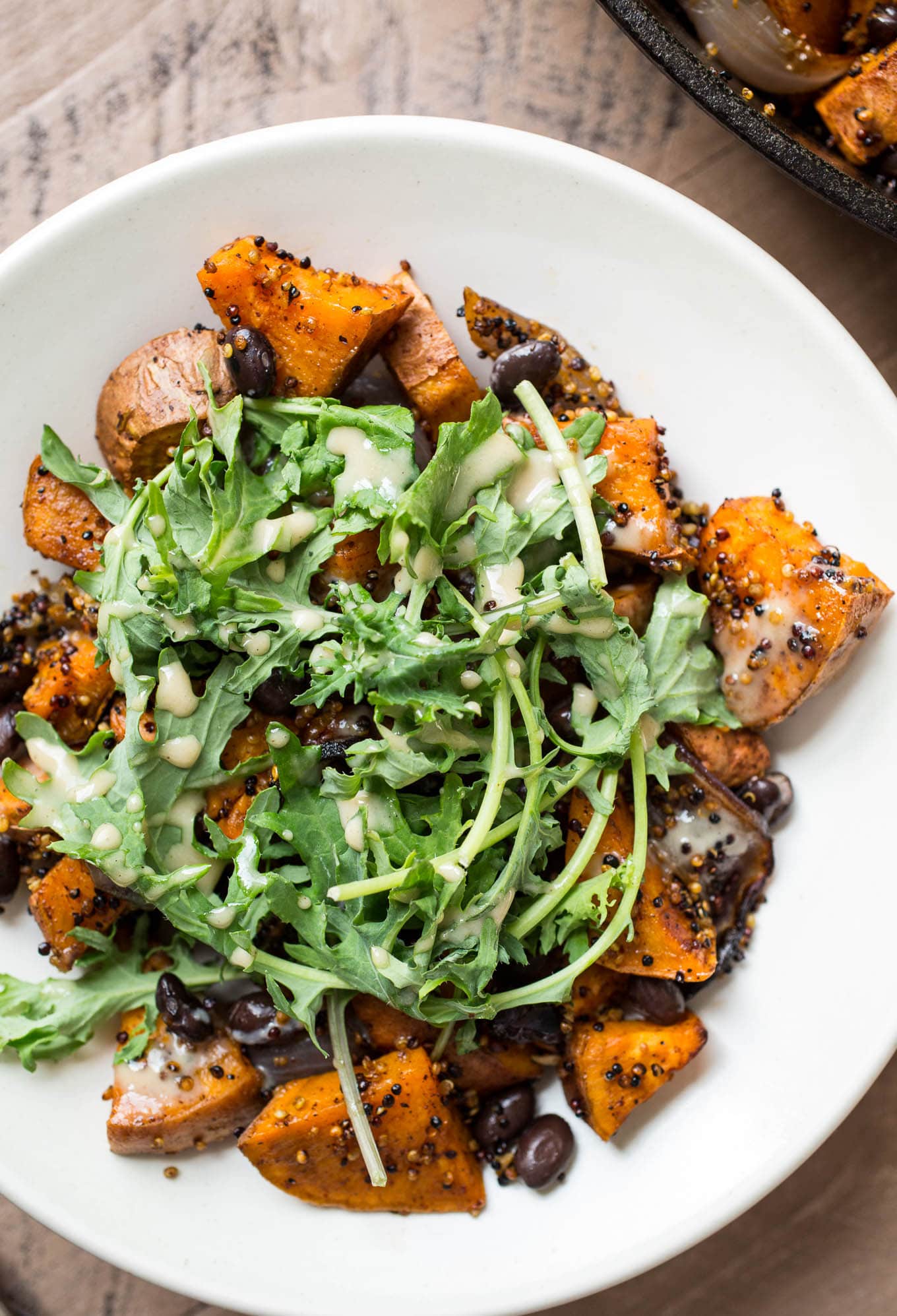 Roasted Sweet Potato, Black Bean, and Fried Quinoa Skillet with Maple-Tahini Sauce | saltedplains.com