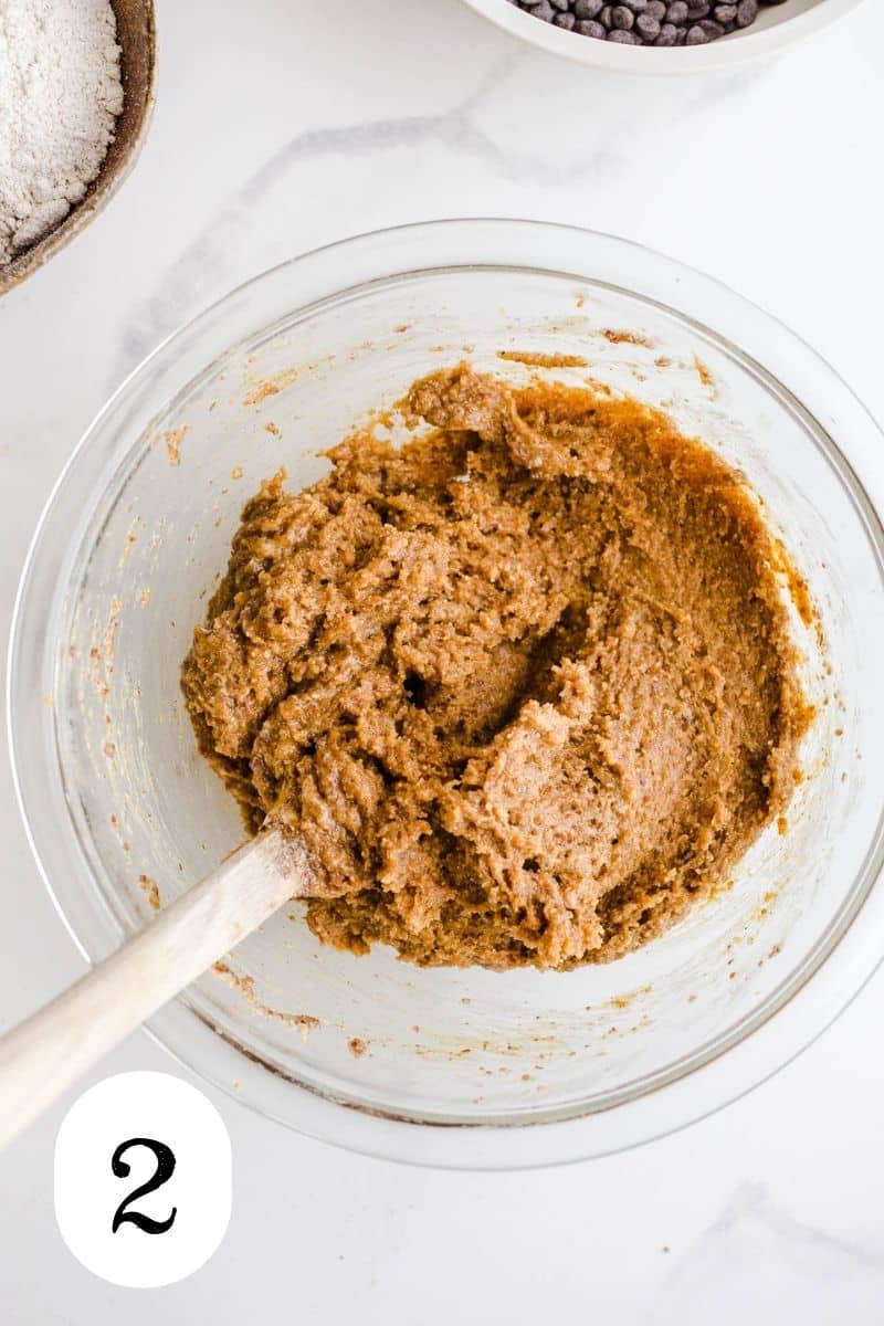 Peanut butter mixture in a glass mixing bowl. 