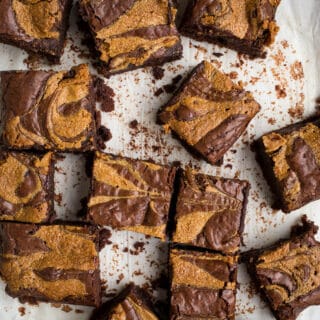 Peanut butter swirl brownies on parchment paper.
