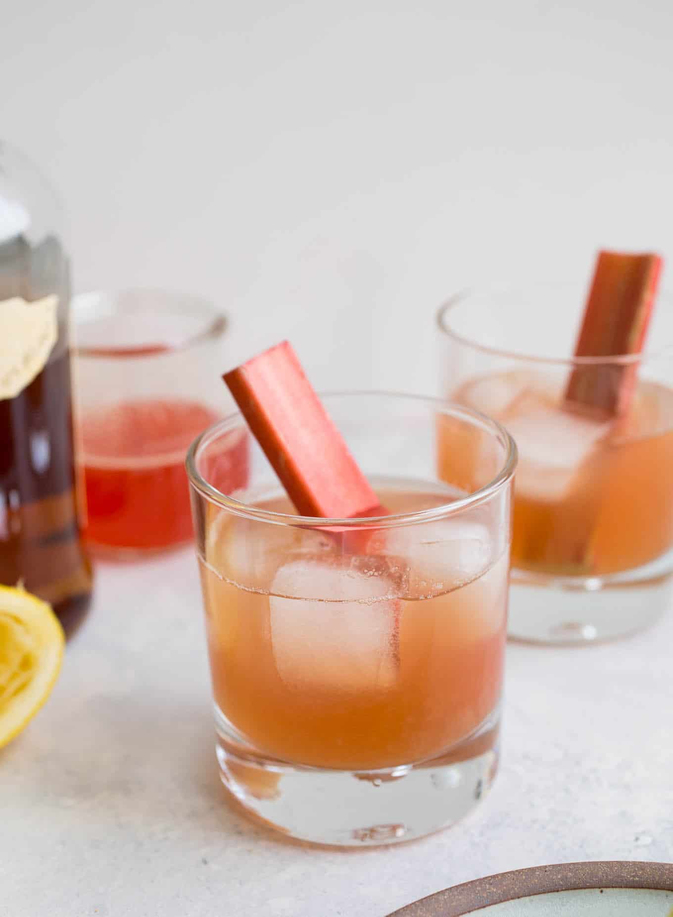 Two bourbon sours in cocktail glasses.