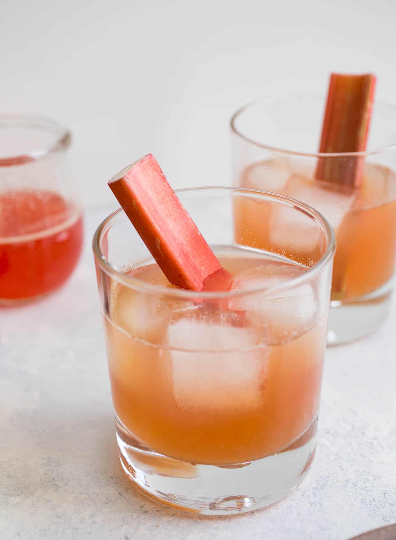 Rhubarb Bourbon Sours in cocktail glasses 