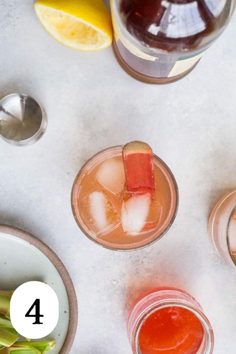 A bourbon sour cocktail in a glass with ice. 