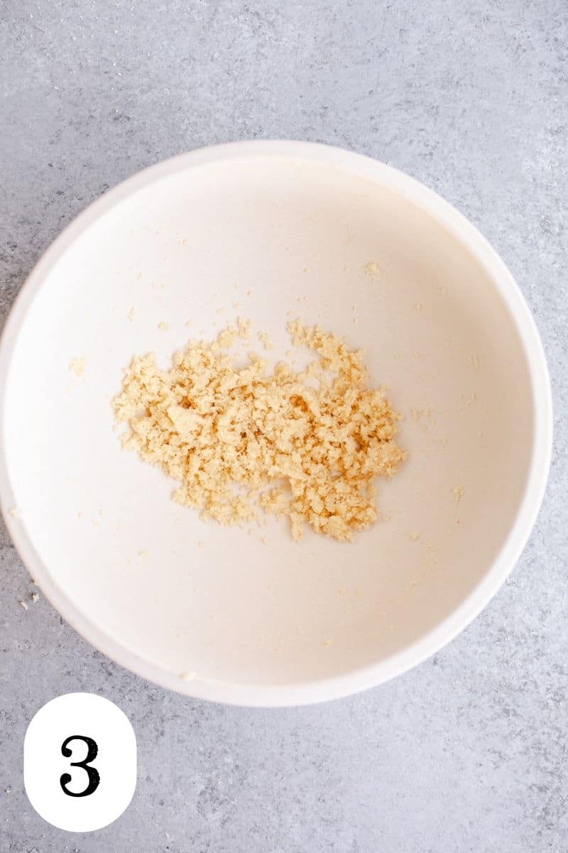 Almond flour crumble in a mixing bowl. 
