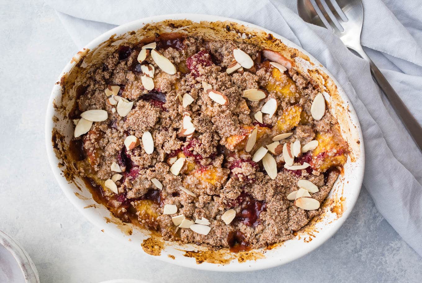This Gluten-Free Raspberry Peach Crumble uses fresh raspberries and peaches, slivered almonds, almond flour, and unrefined coconut sugar and organic cane sugar. Simple to prepare and delicious with vanilla ice cream.