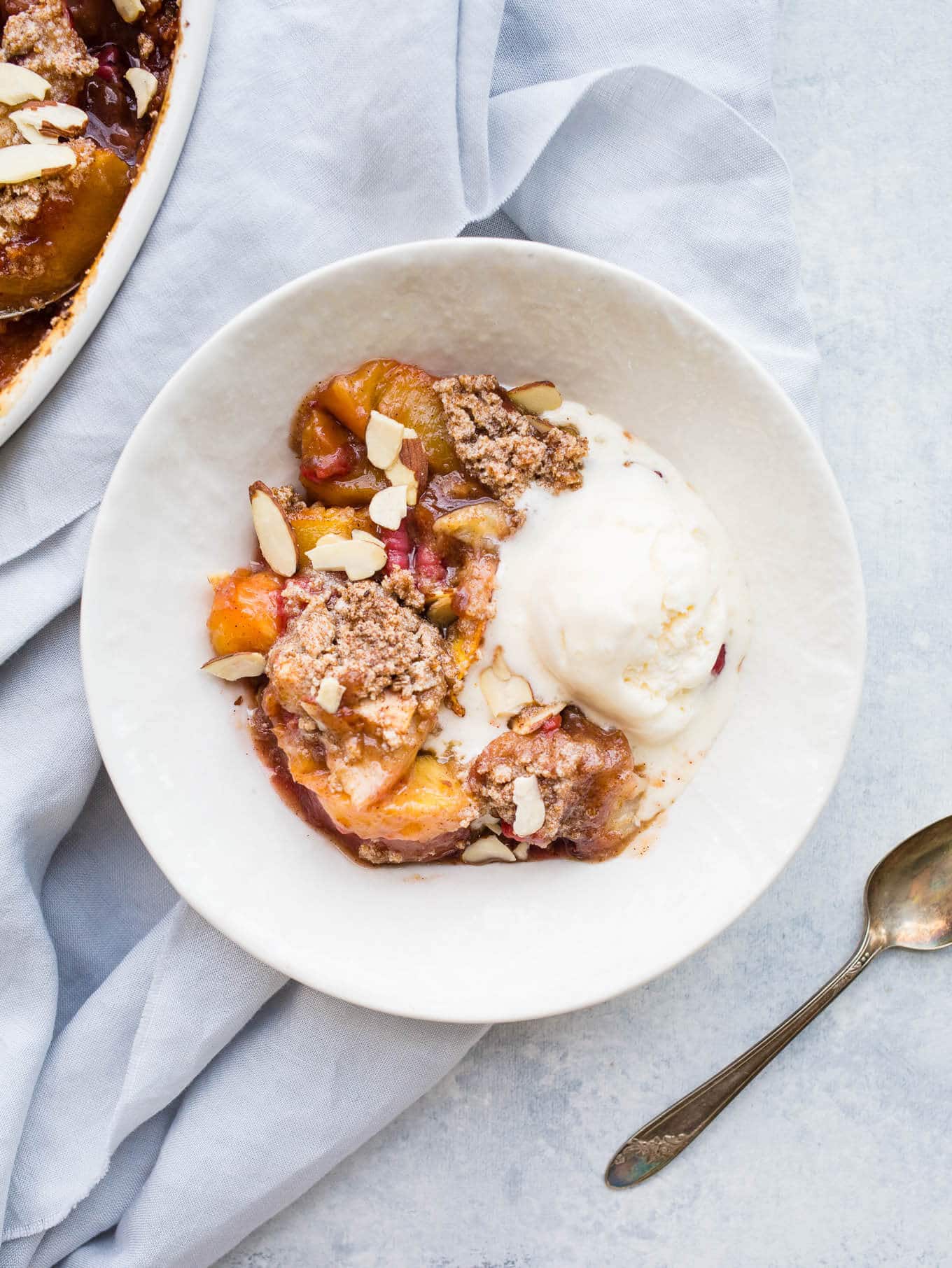 This Gluten-Free Raspberry Peach Crumble uses fresh raspberries and peaches, slivered almonds, almond flour, and unrefined coconut sugar and organic cane sugar. Simple to prepare and delicious with vanilla ice cream.