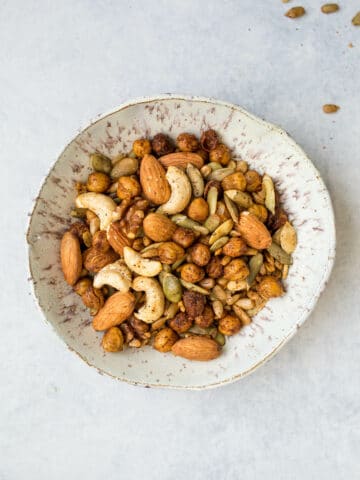 Seasoned nuts and seeds in a bowl.