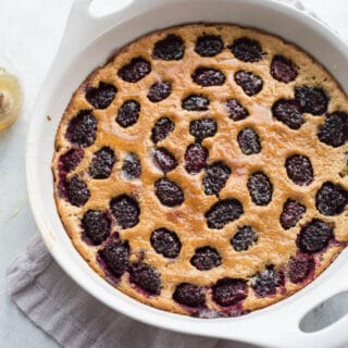 This Blackberry Honey Clafoutis is made with gluten-free almond flour and oat flour and whipped together for ease in a blender. Drizzled with honey and loaded with blackberries, it is a clafoutis recipe you don't want to miss.