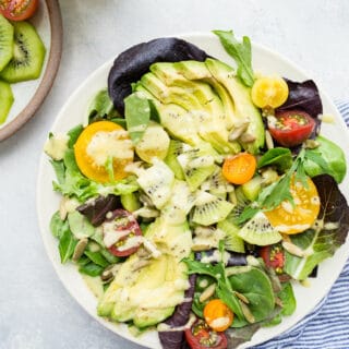 Green salad on a white plate.