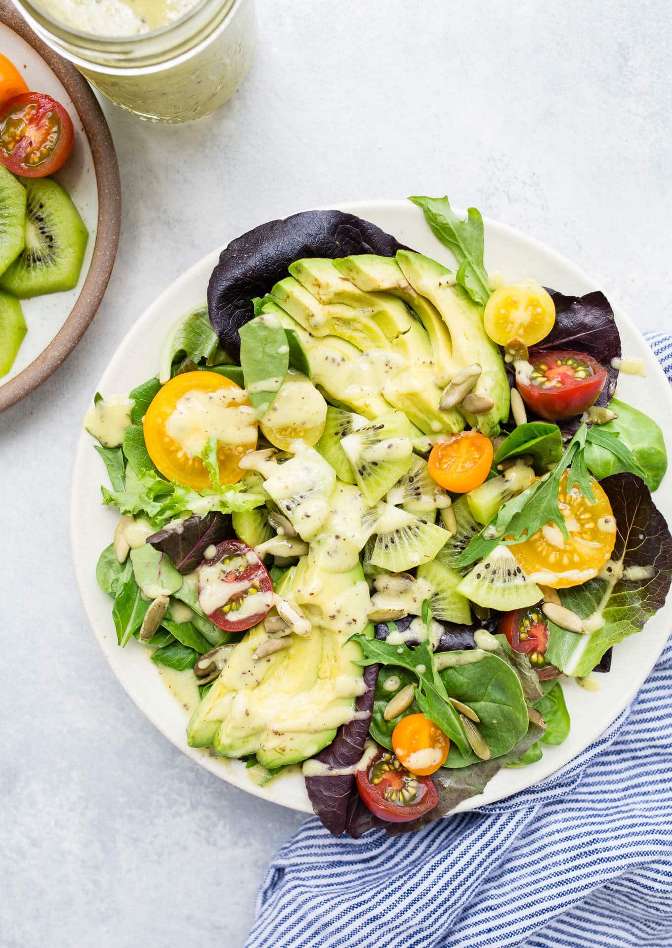 Green salad on a white plate.