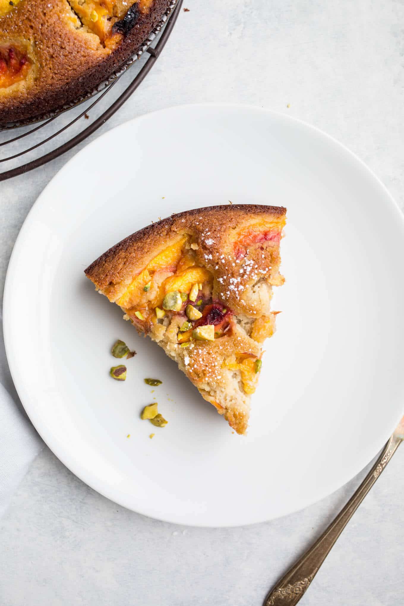 This deliciously moist Olive Oil Cake with Peaches made with almond flour and corn flour is a wholesome treat. Gluten-free, dairy-free, refined sugar-free.