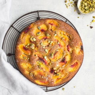 This deliciously moist Olive Oil Cake with Peaches is easy throw together and is not only gluten-free, but dairy-free and refined sugar-free! Made with a combination of almond and corn flours for a wholesome treat.