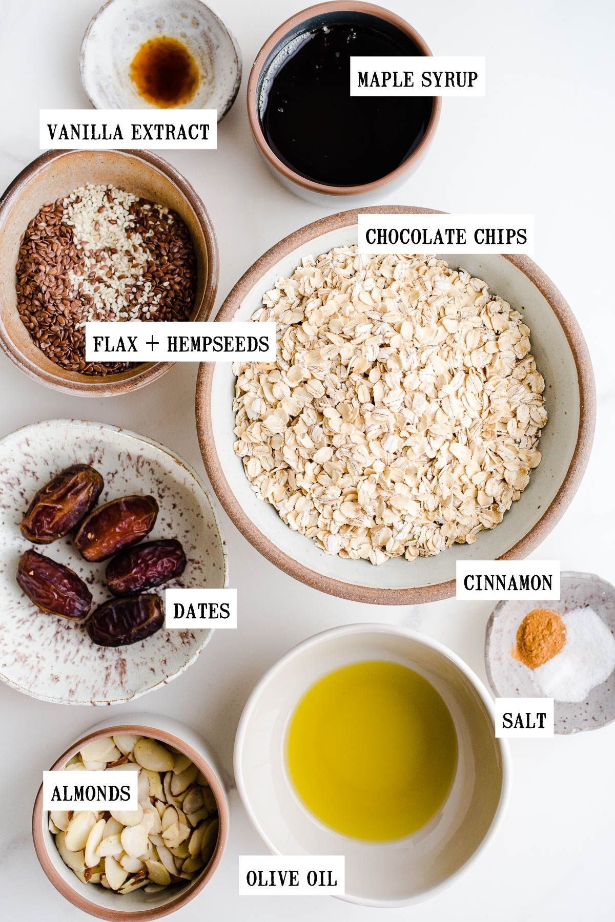 Ingredients to make granola in bowls.