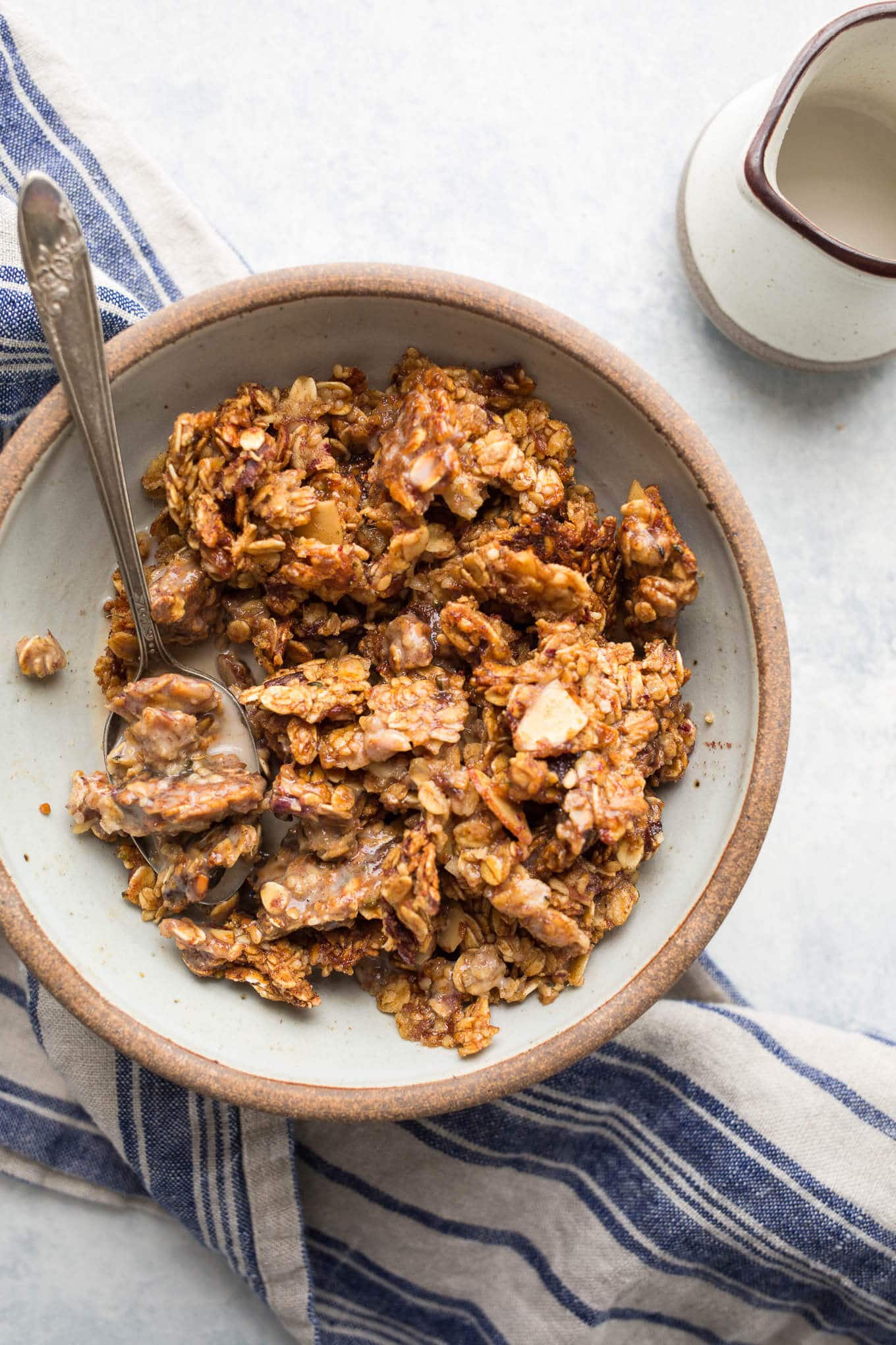 A rustic bowl filled with homemade granola.