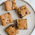 Blondies with chocolate chips on a plate.