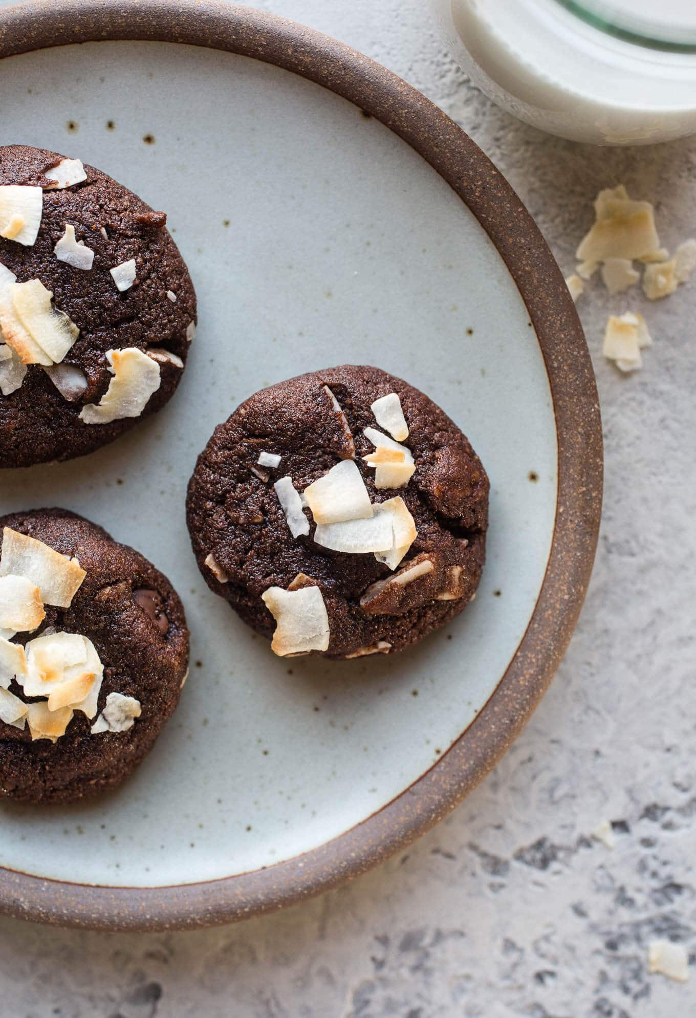 Chocolate coconut cookies on a rustic plate. 