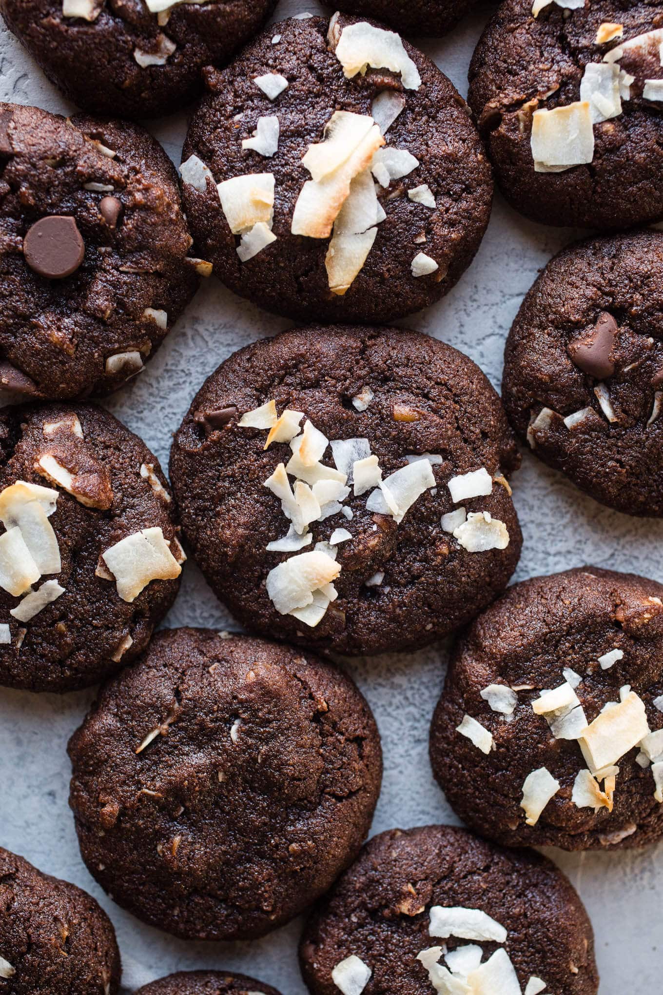 Coconut cookies crowded on a plate. 