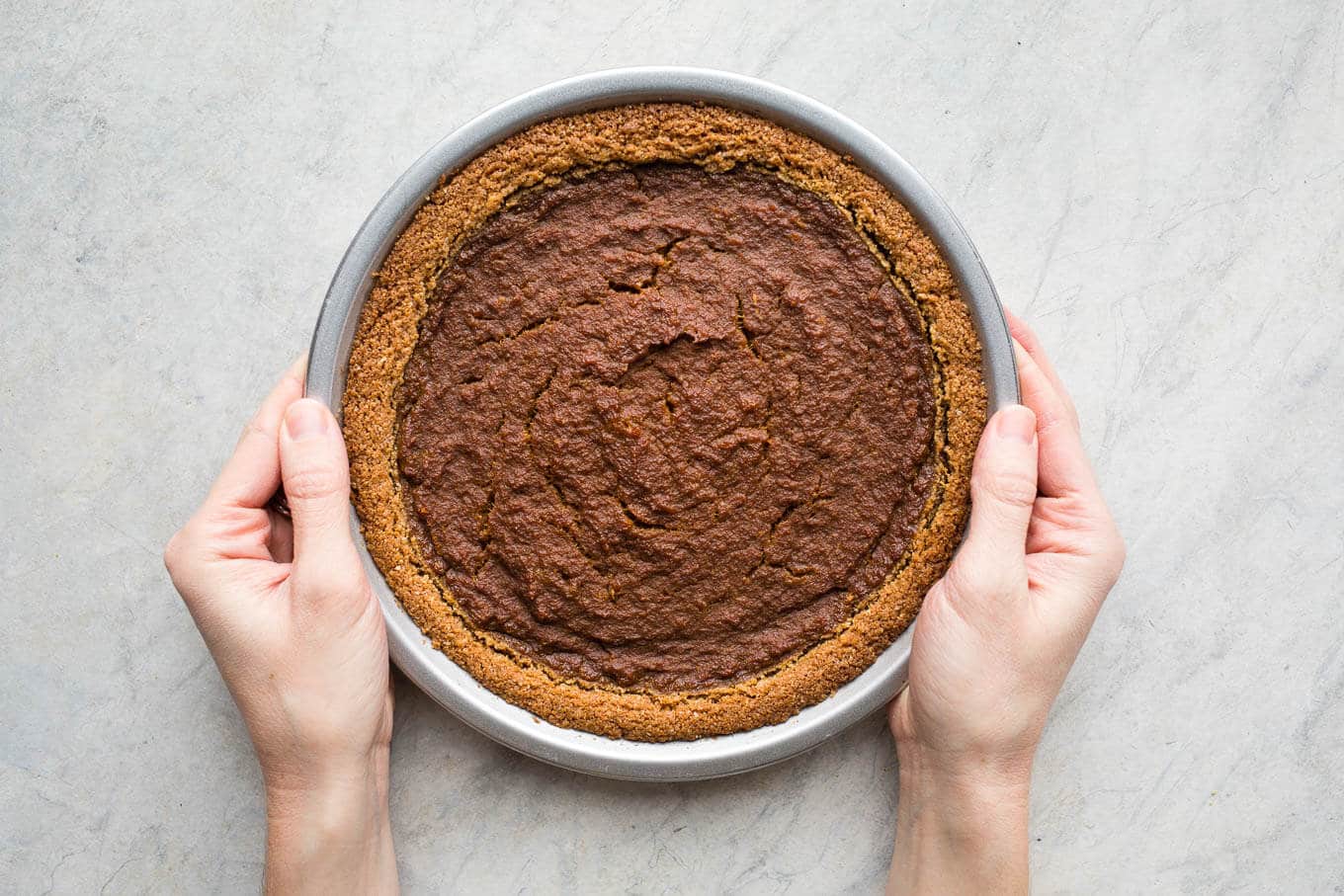 Gingersnap Pumpkin Pie makes for a delicious take on a classic dessert. Made with gingersnap cookie crust and sweetened with coconut sugar and maple syrup. Gluten-free and vegan friendly.