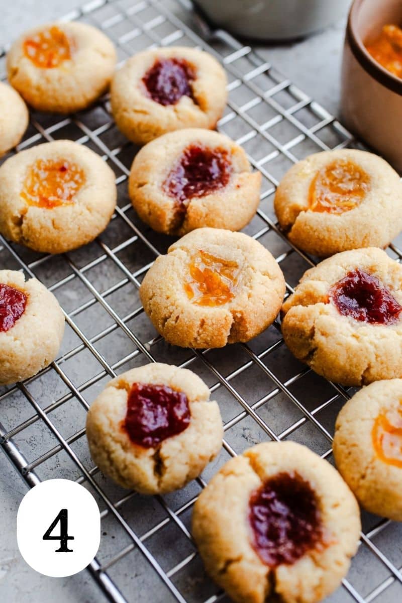 Cooled jam cookies on a wire rack. 