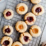Jam cookies on a wire rack.