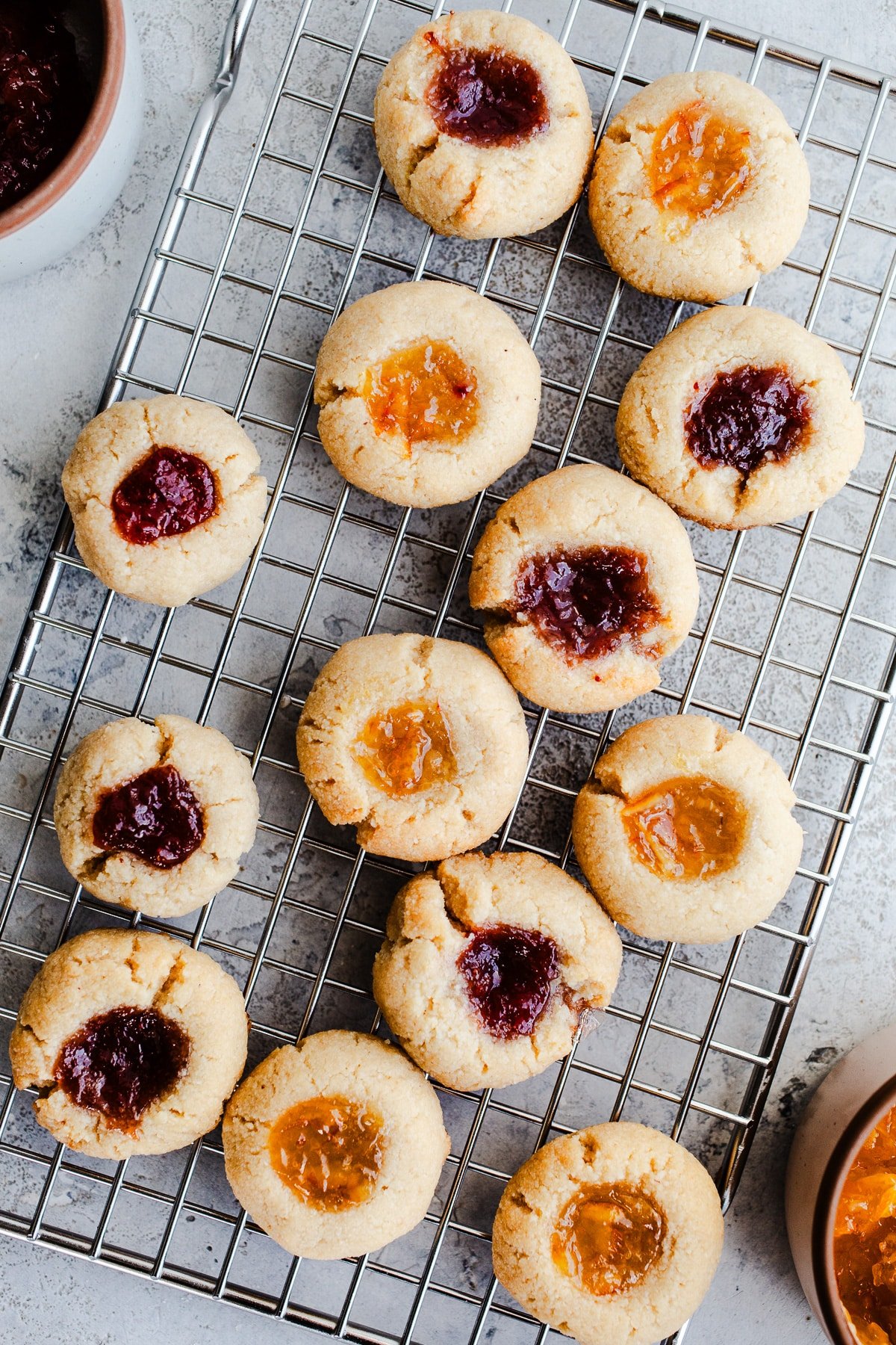 Jam cookies on a wire rack. 