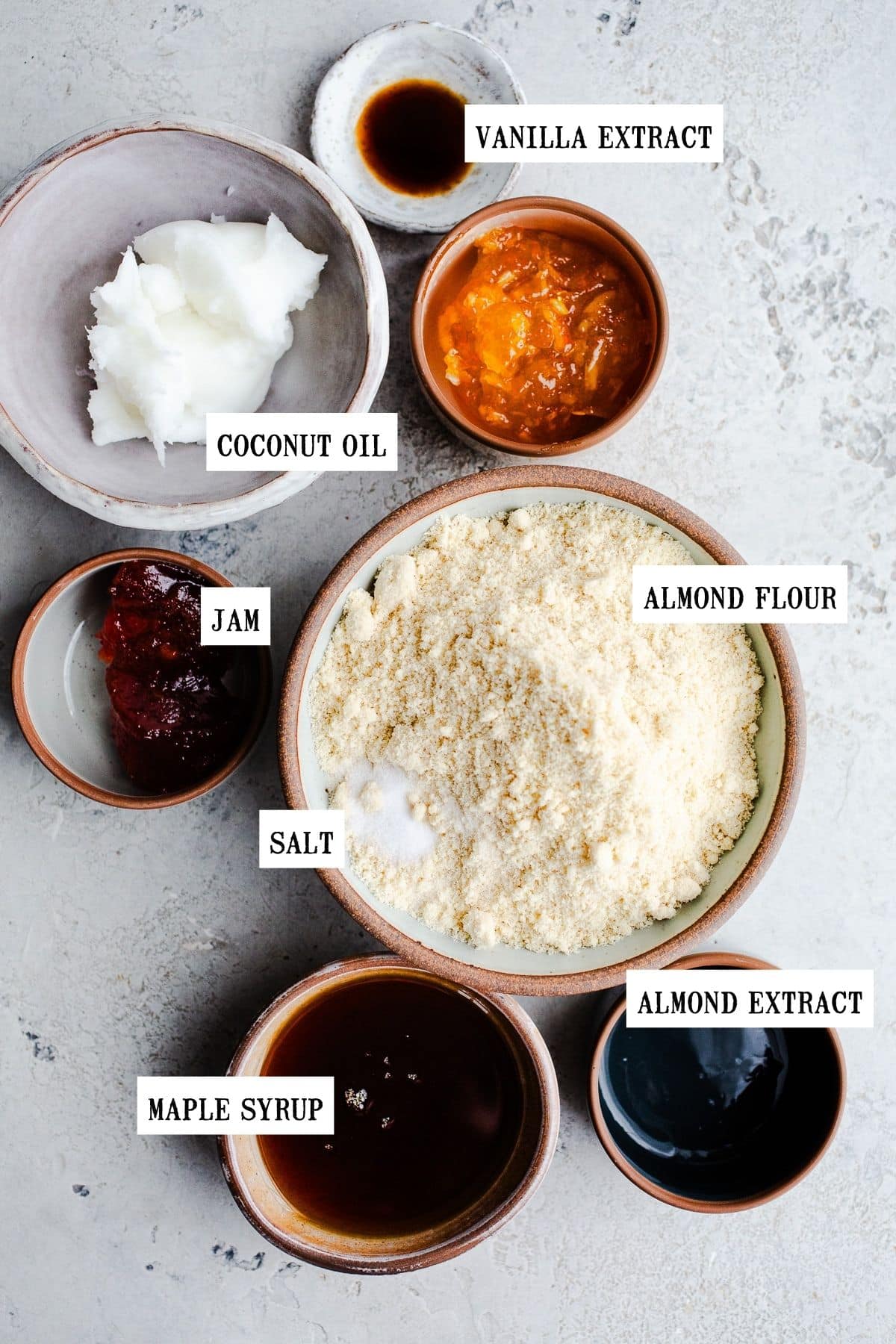 Ingredients to make cookies in small bowls.