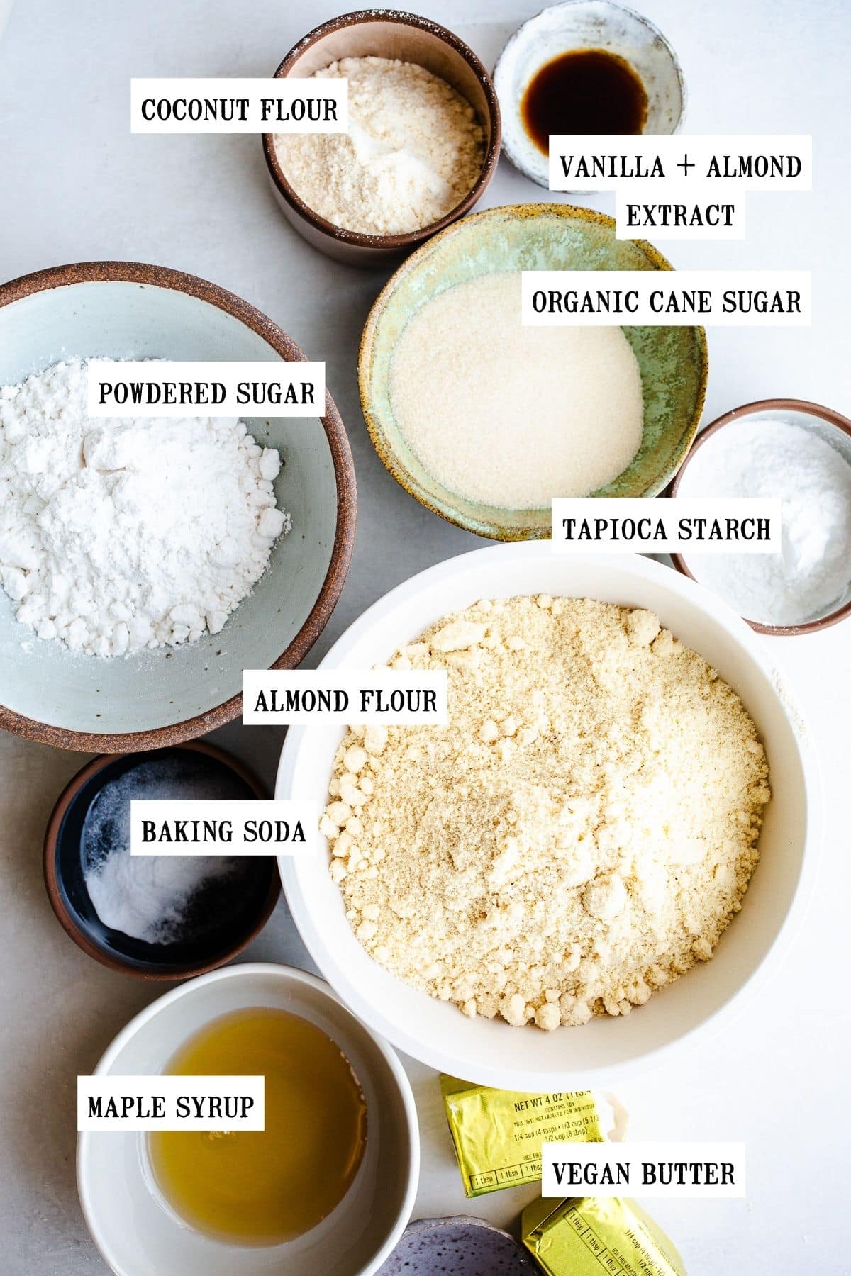 Ingredients to make sugar cookie bars in bowls. 