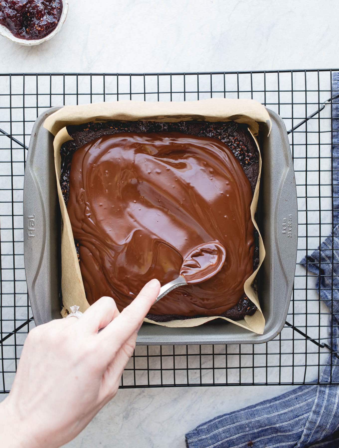 A layer of brownie, a layer of raspberry jam, and a layer of chocolate ganache make up these delicious Raspberry Truffle Brownies. Gluten-Free and dairy-free. 