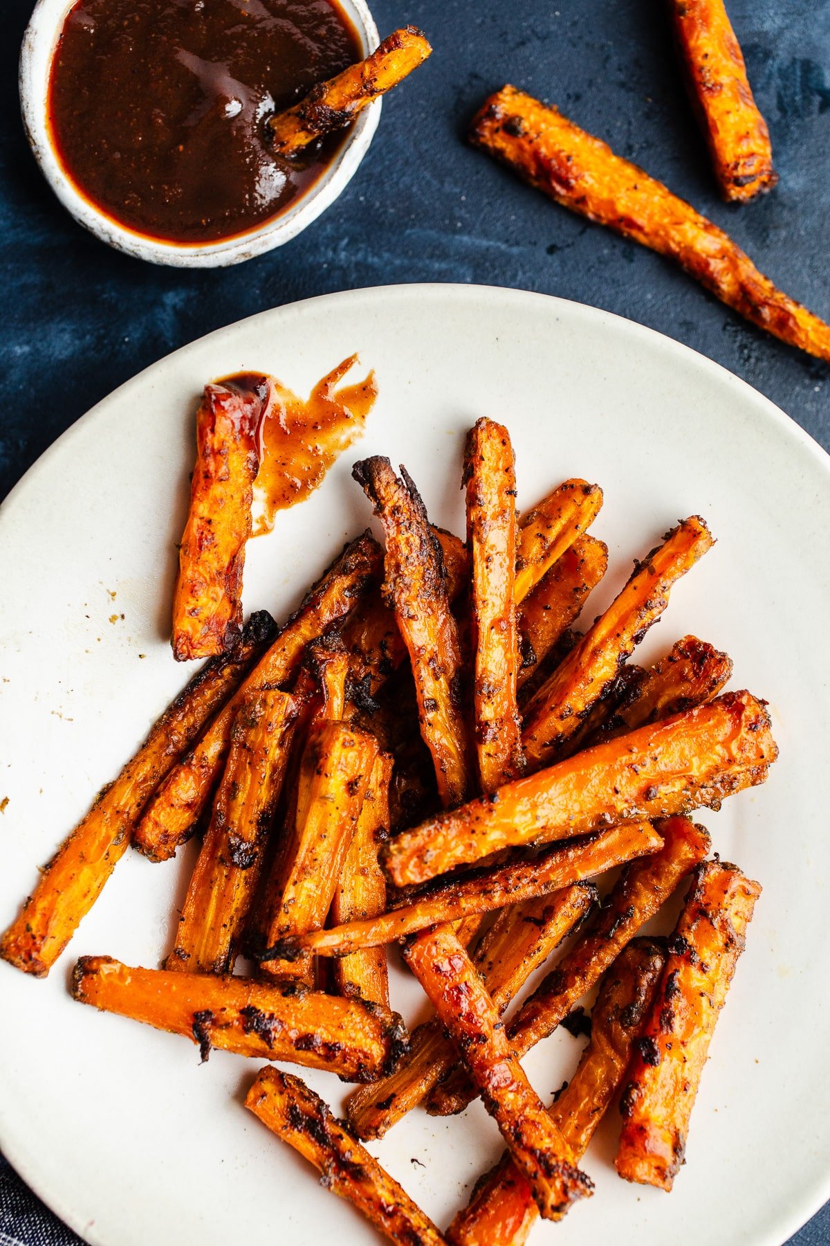 Crispy carrot fries on a plate.