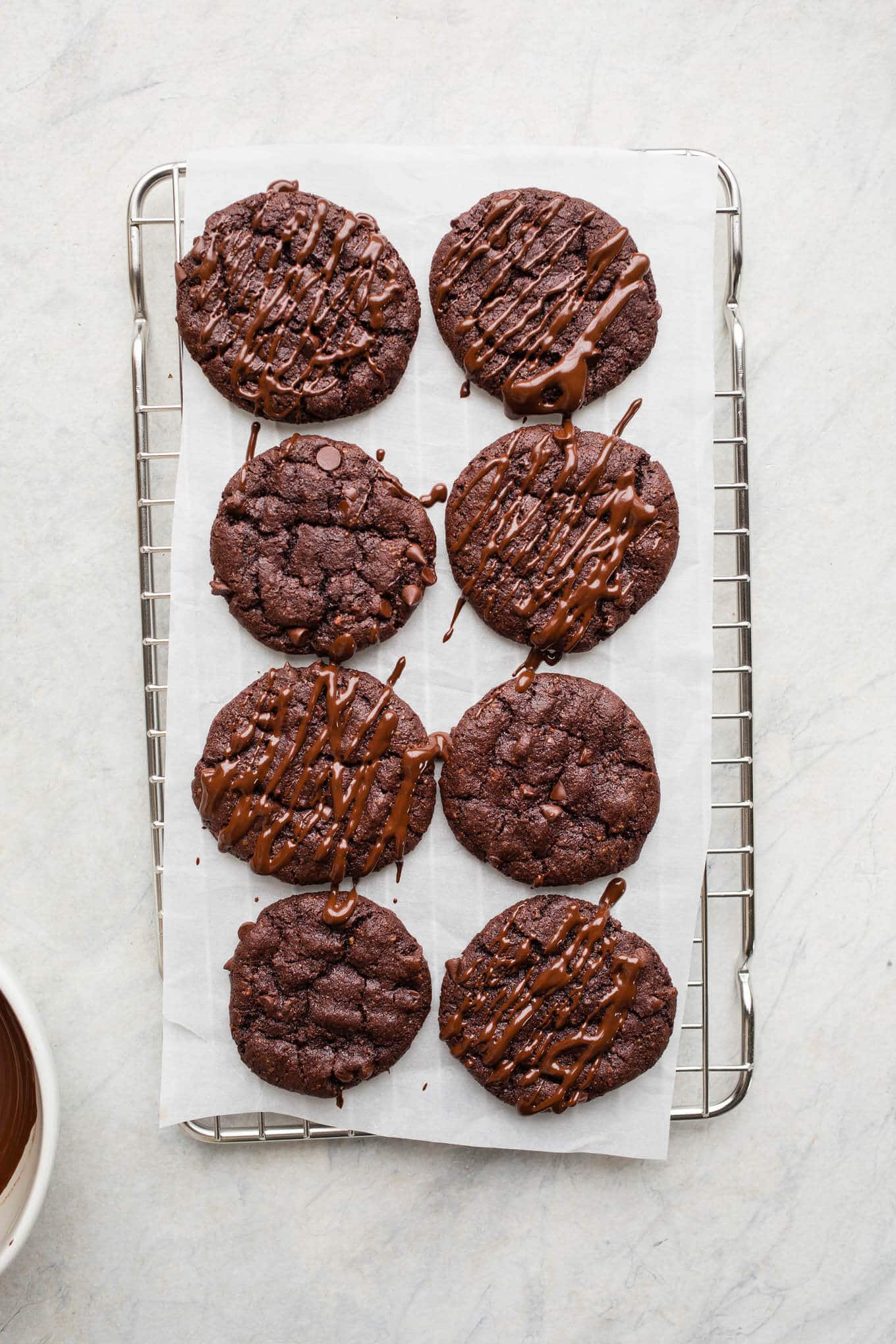 Double Chocolate Chip Hazelnut Cookies made with hazelnut meal, hazelnut butter, cocoa powder, and organic dark chocolate chips for a truly decadent cookie. Gluten-free, grain-free, vegan. 